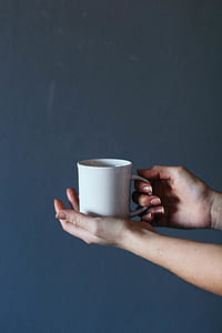 person holding white ceramic mug thumbnail