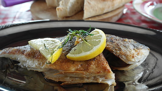 fired fish dish on black plate thumbnail