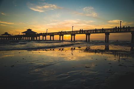 silhouette photography of bridge at golden hour thumbnail