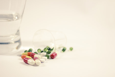 assorted medication tablet in clear shot glass thumbnail