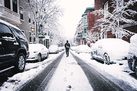 man walking in the middle of street thumbnail