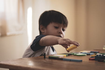Boy Holding Block Toy thumbnail