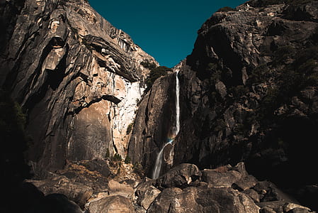 low angle photography of mountain under blue sky thumbnail