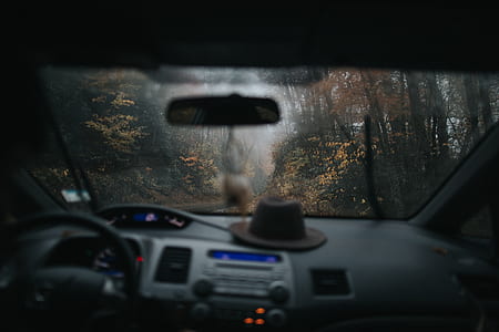 brown cowboy hat on top of vehicle dashboard thumbnail