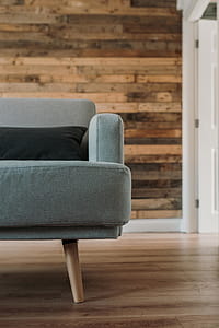 Gray Fabric Sofa Near White Wooden Wall thumbnail