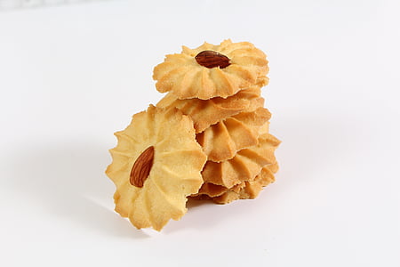 pile of buttered cookies with almond nuts thumbnail