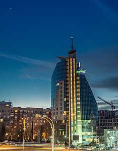 blue and gray building during nighttime thumbnail