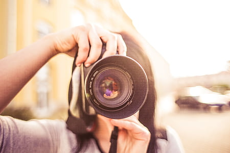 close photography of person taking photo thumbnail