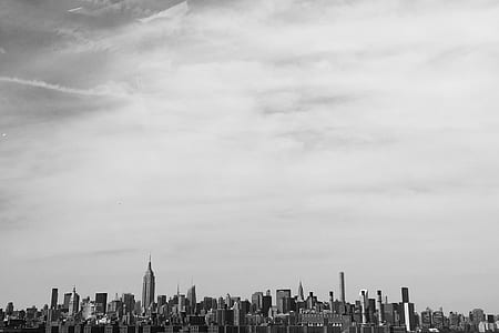 grayscale photography of high rise buildings thumbnail