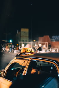 yellow taxi during nighttime thumbnail