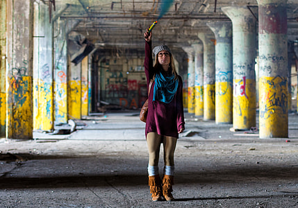 woman wearing purple sweater and brown boots holding flare thumbnail