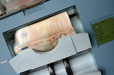 banknotes on gray currency counter thumbnail