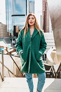 woman wearing green trench coat thumbnail