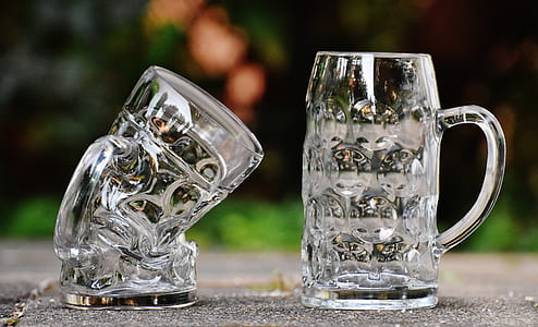 two clear glass beer mugs on gray surface thumbnail