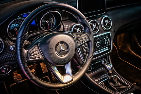 closeup photo of black Mercedes-Benz steering wheel airbag thumbnail