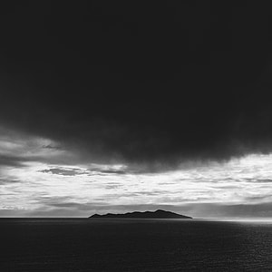 photography of gray clouds top of body of water thumbnail