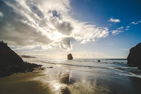photo of seashore under cloudy sky thumbnail
