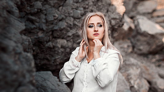 woman standing near boulders thumbnail