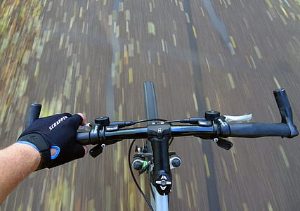 person holding on bicycle handlebar thumbnail