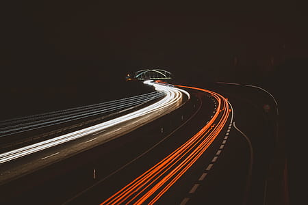 Time Lapse Photography Of Vehicles On Road During Nightime thumbnail