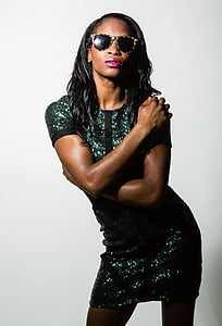 woman wearing sunglasses and sequined teal short-sleeved mini dress thumbnail