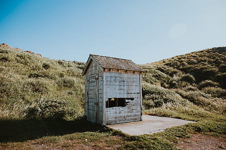 gray shed near hill thumbnail