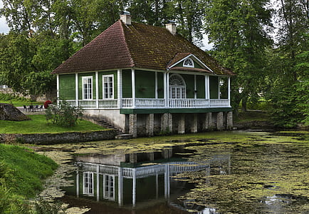 green and brown painted house thumbnail