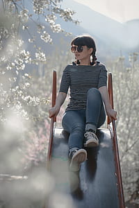 woman sitting on slide thumbnail