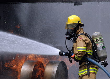 firefighter holding hose thumbnail