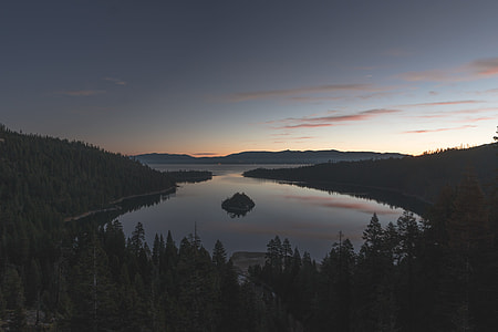 body of water in the middle of mountains thumbnail