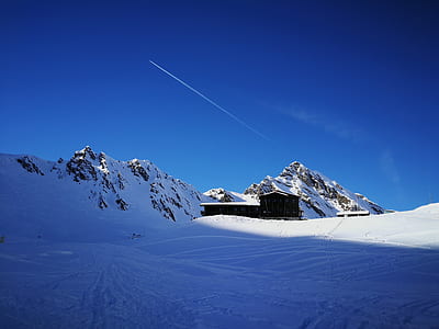 snow field during daytime thumbnail