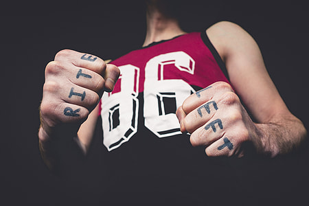 man wearing red, black and white 86 print tank top thumbnail