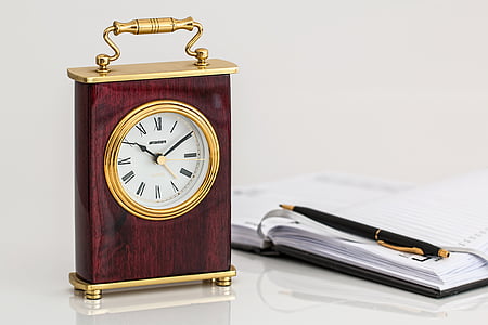brown and gold table clock showing 10:10 thumbnail