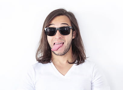 man in white v-neck shirt showing his tongue thumbnail