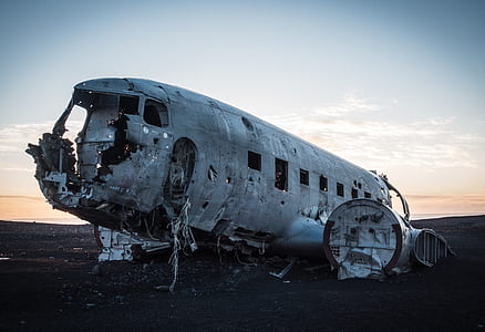 cracked plane on land photography thumbnail