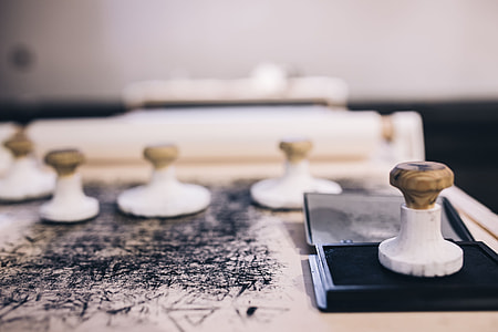Big wooden stamps on a dirty table thumbnail