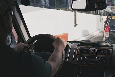 man holding steering wheel thumbnail