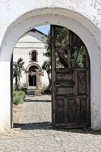 opened brown wooden door during daytime thumbnail
