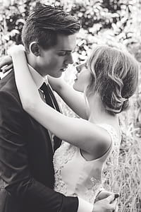 grayscale photography of newly wed couple hugging each other thumbnail
