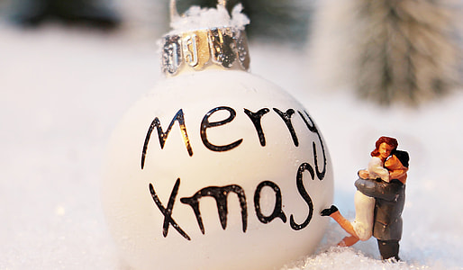 Merry Xmas print bauble and woman and man hugging figurine thumbnail