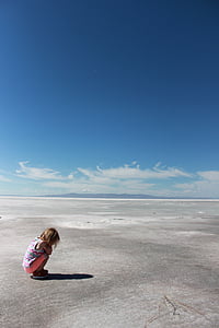 girl sitting on gray surface thumbnail