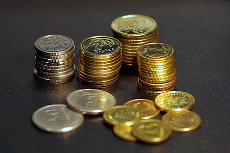 silver and gold colored coins thumbnail
