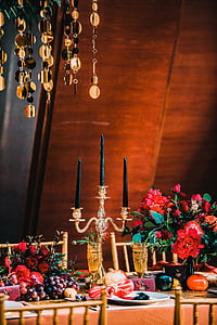brass-colored candle holder on table thumbnail
