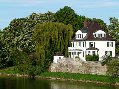 white and brown house near green leafes tree thumbnail