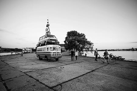Grayscale Photography of People at Asphalt Road With Cars thumbnail