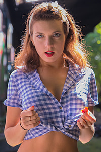 woman in blue and white flannel crop top posing for photo thumbnail