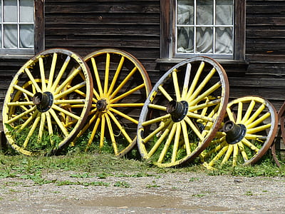 four yellow-and-brown carousel wheels thumbnail