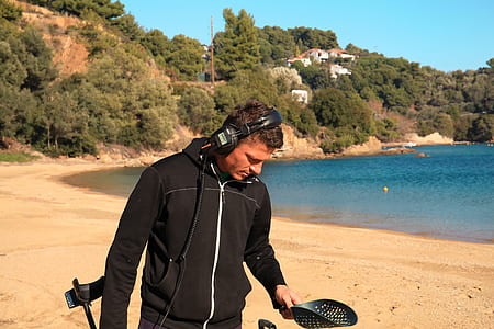 man wearing headphones near seashore thumbnail