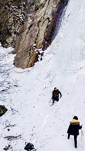 two man and woman on snow thumbnail