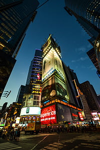crowd crossing on intersection surrounded by high-rise buildings thumbnail
